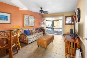 a living room with a couch and a table at Bamboo Suite located across from the beach, 1 Bedroom sleeps 4 in Kihei