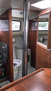 a bathroom with a sink and a toilet in a boat at Yacht & Breakfast in Bergen