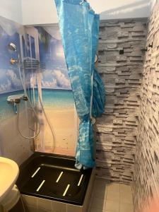 a bathroom with a shower with a view of the beach at Mira in Gernsbach