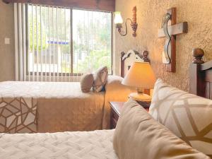 Postel nebo postele na pokoji v ubytování Villas Layfer, Córdoba, Veracruz, Mexico