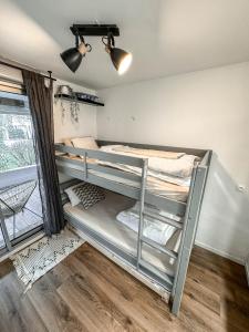 Poschodová posteľ alebo postele v izbe v ubytovaní T3- un Oasis rénové et climatisé au centre de LGM