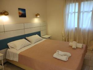 A bed or beds in a room at Vanilla House Paleokastritsa