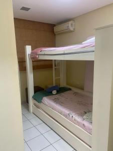 a couple of bunk beds in a room at Apartment Neo 2.0 in Maceió