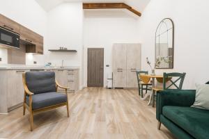 a living room with a couch and a table at Deansgate Luxury Apartments in Manchester +38 photos