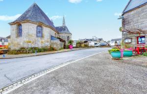 an empty street in front of a church at 1 Bedroom Stunning Apartment In Melrand in Melrand