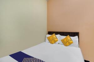 Postel nebo postele na pokoji v ubytování SPOT ON Hotel Sai Ashirwad Residency