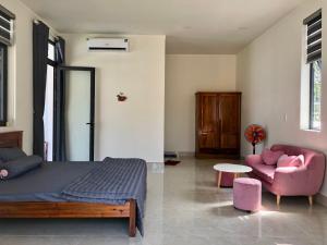 Postel nebo postele na pokoji v ubytování Happy House An Thới PQ + 12 fotografií