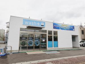 a wasatch store with a sign on the front of it at ecoHotel in Toyama