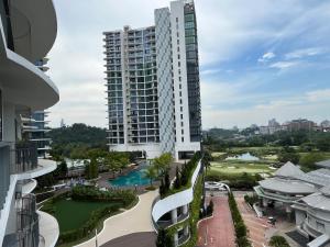 an aerial view of a building with a pool at Homestay KLGCC KL Golf Country Club Senada Residences in Kuala Lumpur