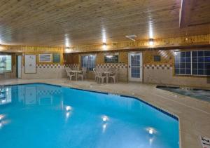 a large swimming pool with a wooden ceiling at Holiday Inn Express Jackson, an IHG Hotel in Jackson