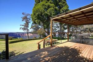 a wooden deck with a view of the grand canyon at Allview Escape Blackheath in Blackheath