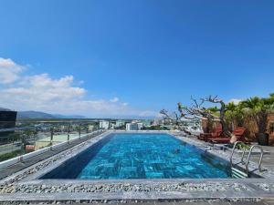 a swimming pool on top of a building at MTR Apartment & Hotel in Danang