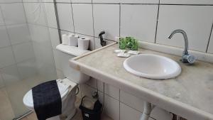 a bathroom with a sink and a toilet at Casa de Praia Iguape Ceará Paraíso in Aquiraz +29 photos