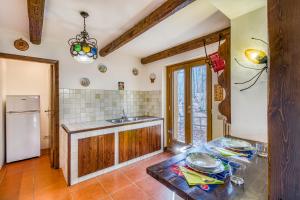 Η κουζίνα ή μικρή κουζίνα στο Family Chalet In Monte Amiata - Happy Rentals