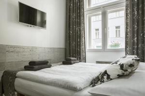 Posteľ alebo postele v izbe v ubytovaní Royal Court Hotel