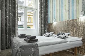 Posteľ alebo postele v izbe v ubytovaní Royal Court Hotel