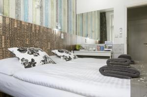 Posteľ alebo postele v izbe v ubytovaní Royal Court Hotel