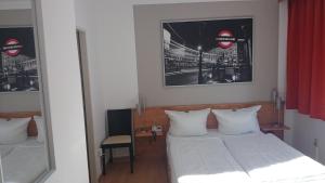Säng eller sängar i ett rum på Hotel Novostar