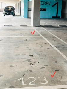 a parking lot with a car parked in a garage at Lumi Tropicana (2 in 1) sleep up to 18 in Petaling Jaya