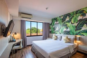Postel nebo postele na pokoji v ubytování Liberta Seminyak Hotel + 37 fotografií