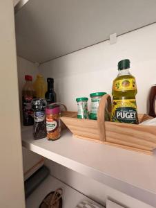 a shelf in a refrigerator filled with lots of condiments at Appartement T2 Petite Jade in Luchon +7 photos