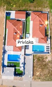 uma visão geral de uma representação de um edifício em Villas Sabun - modern house with heated pool em Privlaka