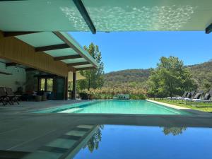 a swimming pool in the backyard of a house at Blair Athol Estate Wollombi in Wollombi