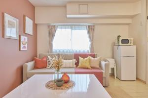 a living room with a couch and a table at It’ ta de MORRIS/RETRO in Osaka +73 photos