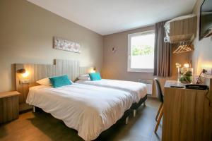 Postel nebo postele na pokoji v ubytování Hotel Ecluse 34