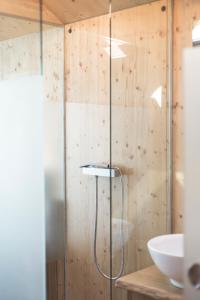a bathroom with a shower and a sink at Glamping house Julija - Wellness & View in Ivanjkovci