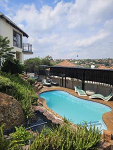 a swimming pool in the middle of a yard at Boutique Stay in Johannesburg