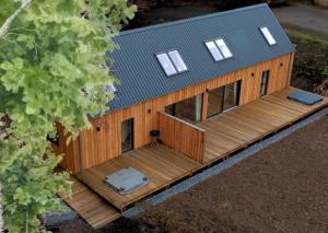 an overhead view of a house with a deck at Forest Corner Luxury Home with Hot Tub in North Ballachulish