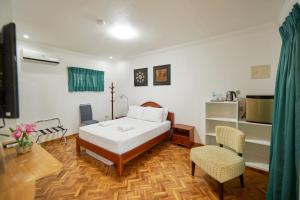 Katil atau katil-katil dalam bilik di Garden Bungalows Resort