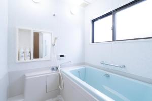Uma casa de banho em 最大10人から25人まで宿泊可能三宮駅至近1フロア貸切コンドミニアム