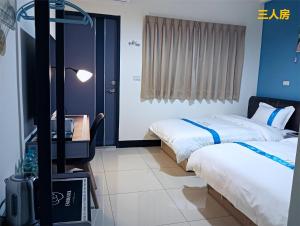 Letto o letti in una camera di 塔斯汀精品民宿