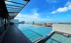 a swimming pool on the roof of a building at Mykey The Quartz A-10-09 Melaka City in Melaka