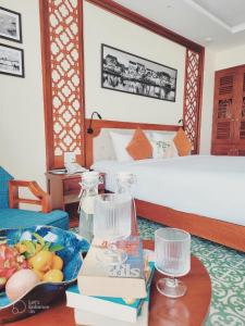 Mỹ Sơn Boutique Hotel & Spa tesisinde bir odada yatak veya yataklar