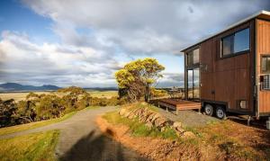 a tiny house sitting on top of a dirt road at Montara Views 3 in Ararat