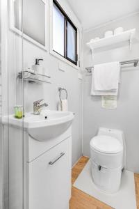 a white bathroom with a sink and a toilet at Montara Views 3 in Ararat