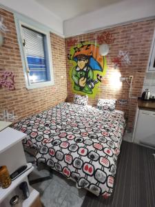 a bedroom with a bed with a cartoon gmaxwell gmaxwell at Street Art Suite in Zagreb