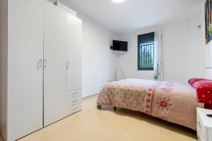 Un pat sau paturi într-o cameră la Viudelta