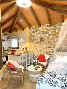 a kitchen and a bedroom with a bed and a table at One bedroom house with shared pool terrace and wifi at Biescas in Biescas