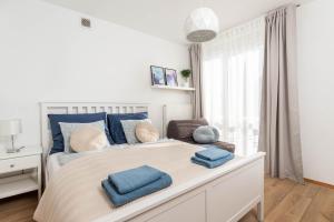 Posteľ alebo postele v izbe v ubytovaní Jonagold Apartment Metro Raclawicka