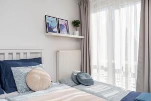 Posteľ alebo postele v izbe v ubytovaní Jonagold Apartment Metro Raclawicka + 18 fotografií