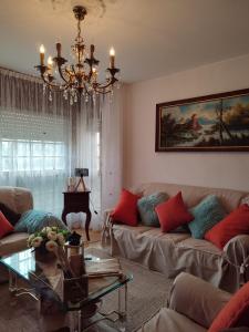 a living room with a couch and a table at Casa da Rapadoira 