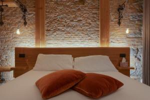 Voodi või voodid majutusasutuse San Nicolò Suites toas