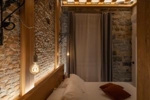Voodi või voodid majutusasutuse San Nicolò Suites toas