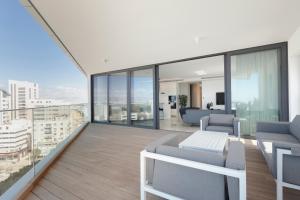 an apartment balcony with a view of a city at Nicosia Central Park Residences in Nicosia