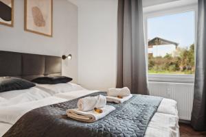 Säng eller sängar i ett rum på ANDRISS - Serviced Apartments I Workstations I WIFI