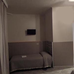 Televízia a/alebo spoločenská miestnosť v ubytovaní Villa Oasi
